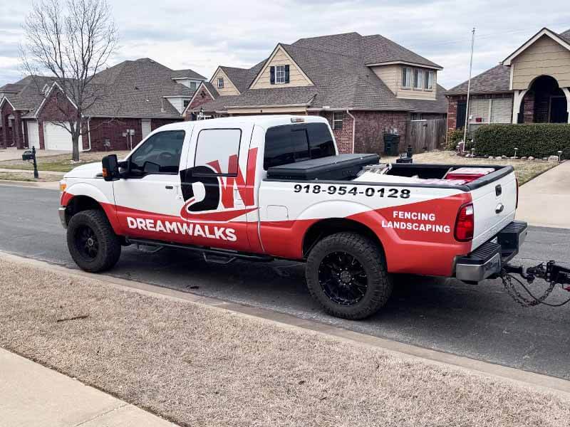 Dream Walks Fencing and Landscaping installing a fence