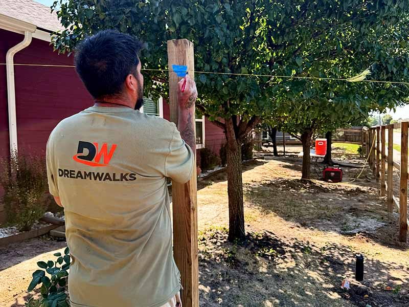 Tape measure in the grass of a homeowners backyard